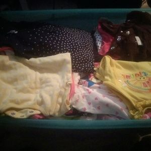Bin of baby clothes